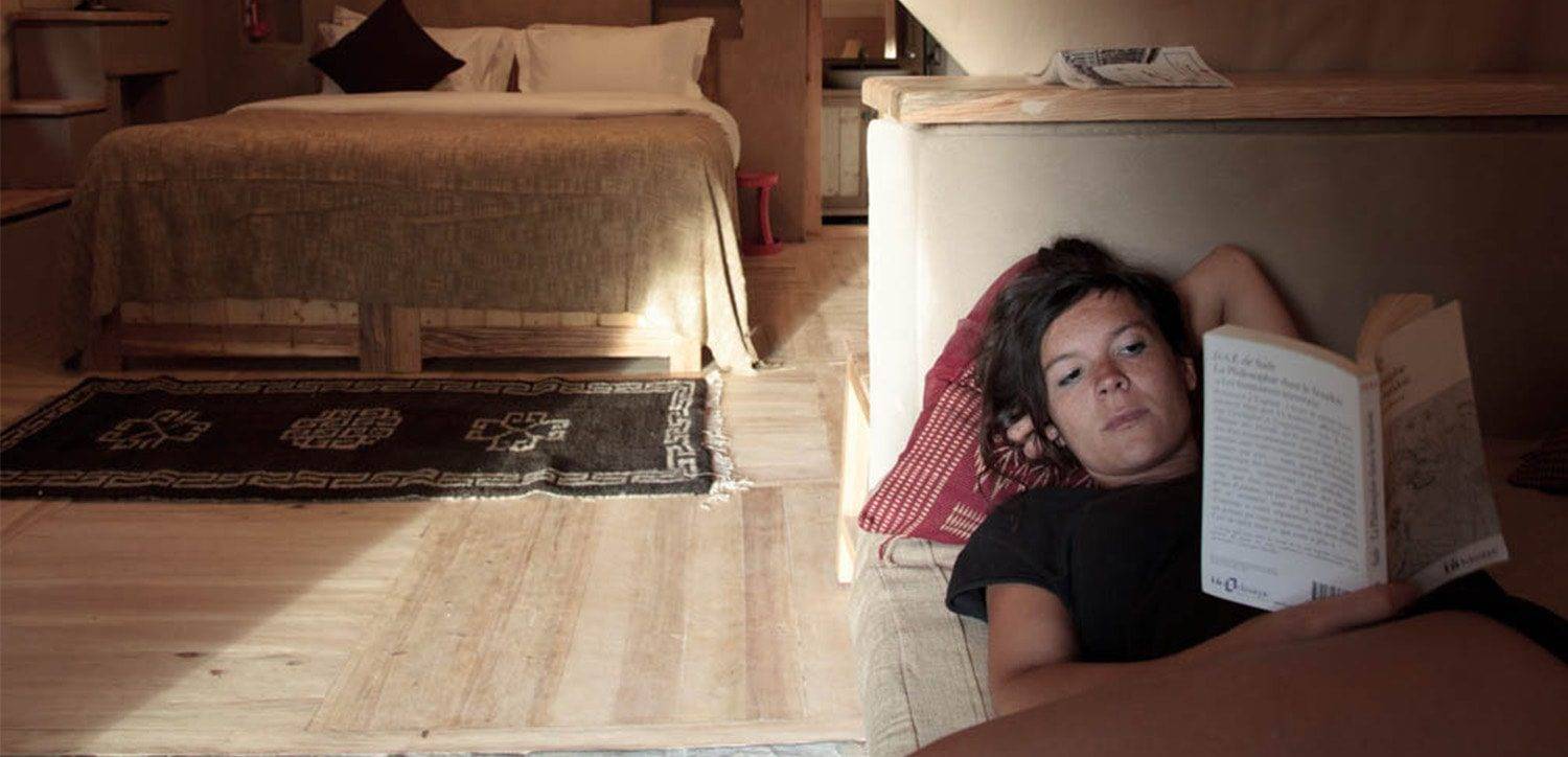 Family engaging in a cooking class at Nimmu House, learning to prepare traditional Ladakhi dishes with fresh, organic ingredients.